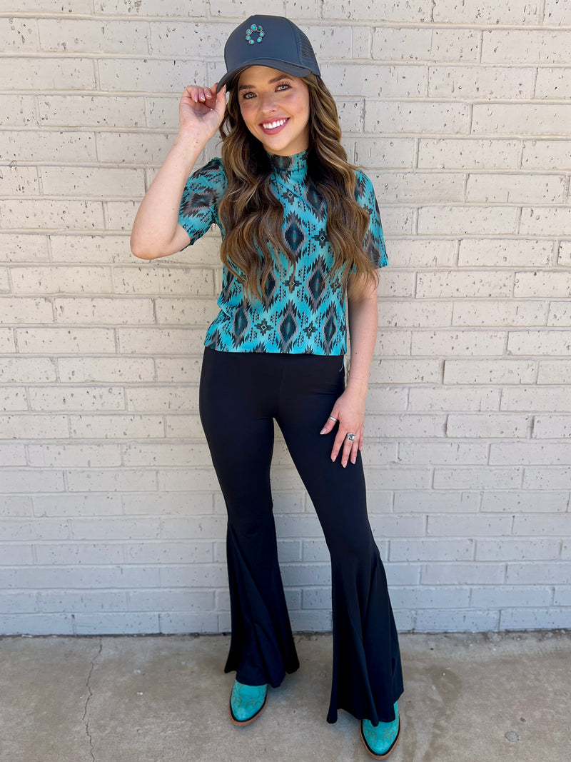 Sterling Kreek Bell Bottoms. Bell Bottoms. black pants. High waisted pants. black Bell bottoms. Stretchy pants. Comfortable pants. Western style. Women's western wear. Women's black pants. Women's western boutique. Women's western wear. Online boutique. Small business. Woman owned. 