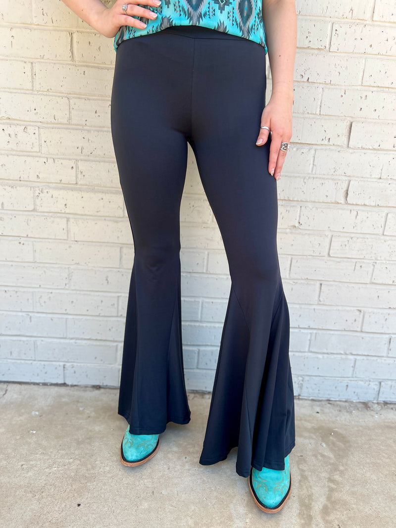 Sterling Kreek Bell Bottoms. Bell Bottoms. black pants. High waisted pants. black Bell bottoms. Stretchy pants. Comfortable pants. Western style. Women's western wear. Women's black pants. Women's western boutique. Women's western wear. Online boutique. Small business. Woman owned. 