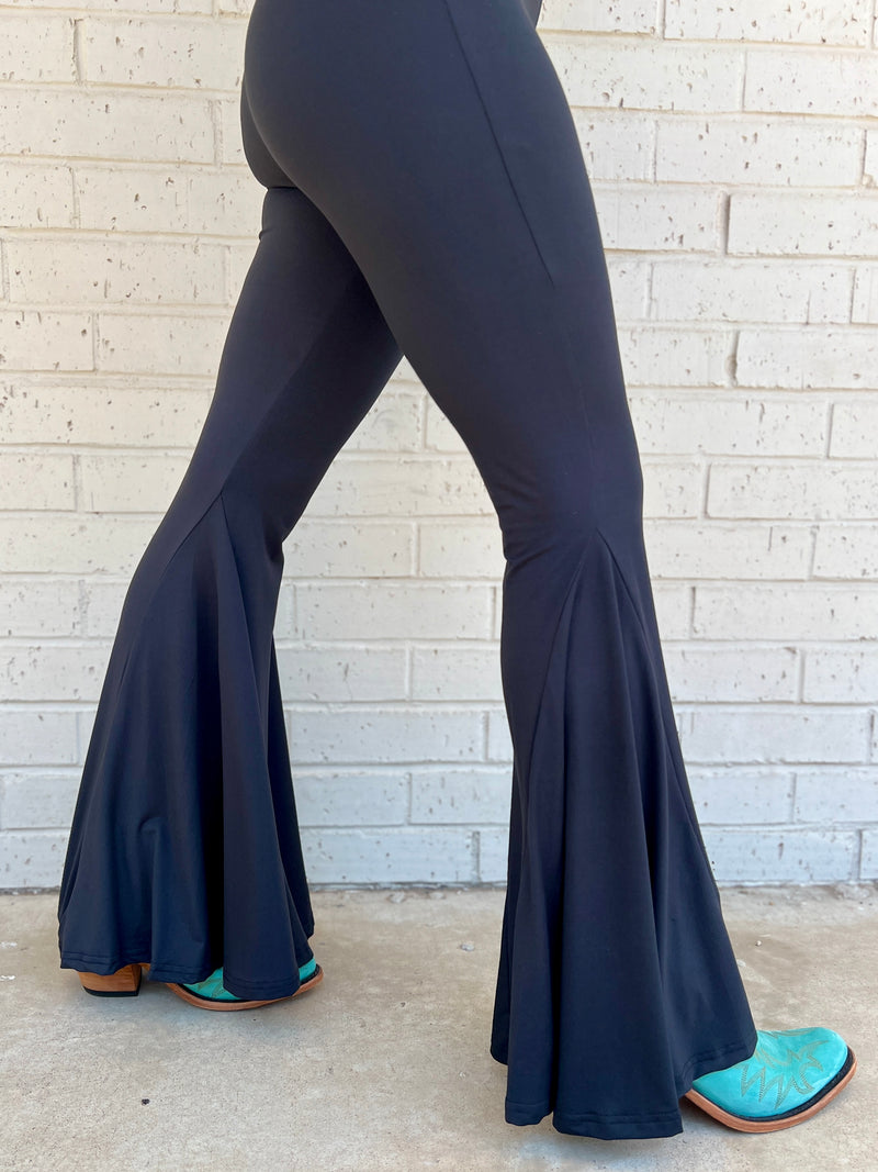 Sterling Kreek Bell Bottoms. Bell Bottoms. black pants. High waisted pants. black Bell bottoms. Stretchy pants. Comfortable pants. Western style. Women's western wear. Women's black pants. Women's western boutique. Women's western wear. Online boutique. Small business. Woman owned. 