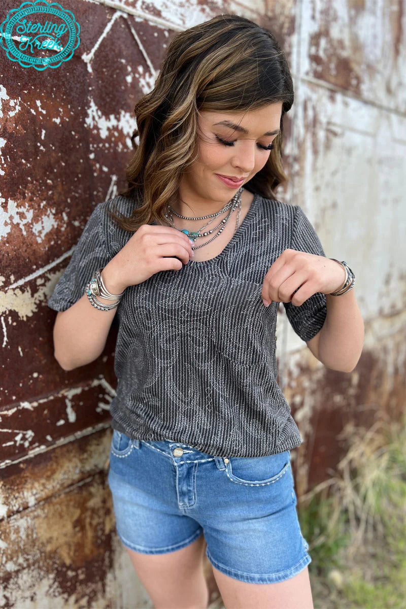 Sterling Kreek Rodeo Roundup Top / Gussied Up Online. top. women's top. short sleeve. black. ribbed. cream. boot stitch. v neck. womens western apparel. small business. Women's western boutique. Ships fast from Texas.  