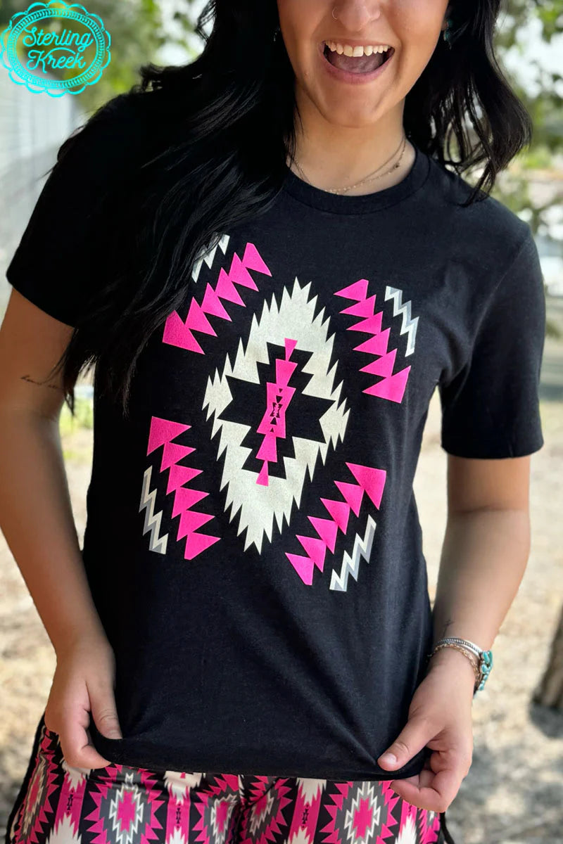 Sterling Kreek Overhead Outlaw Tee I Gussied Up Online. graphic tee. top. women's top. crew neck. short sleeve. black. pink. white. aztec. aztec print. small business. Women's Western Boutique. Ships fast from Texas.