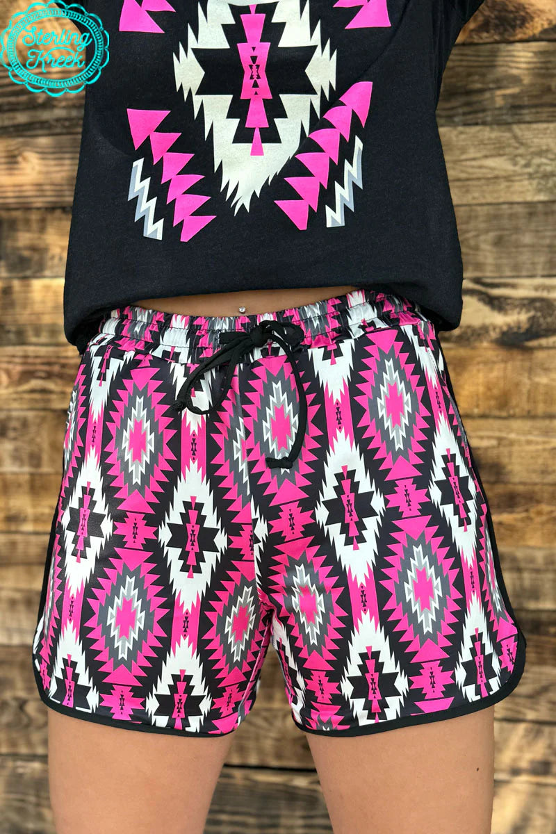Sterling Kreek Road To You Shorts- Long I Gussied Up Online. bottoms. shorts. black. pink, white. aztec. aztec print. pockets. drawsting. long length. small business. Women's Western Boutique. Ships fast from Texas. New Crazy Train.